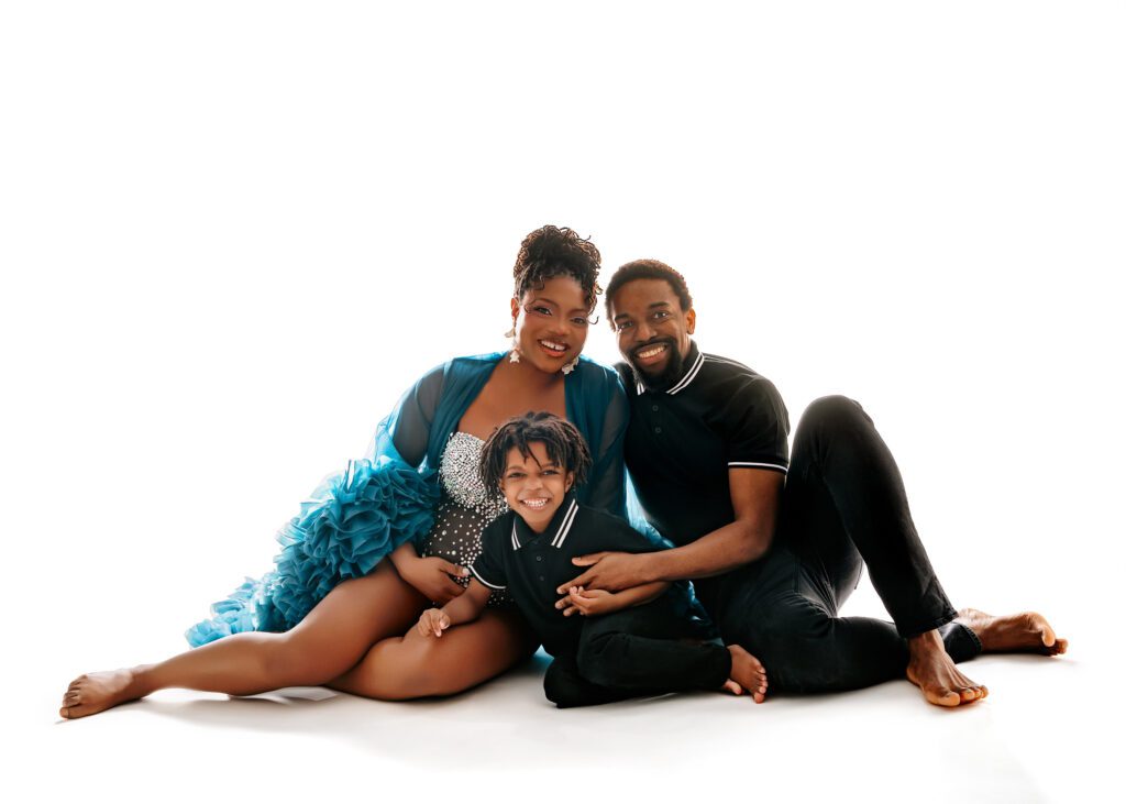 Studio maternity portrait showing family connection in Winnipeg
