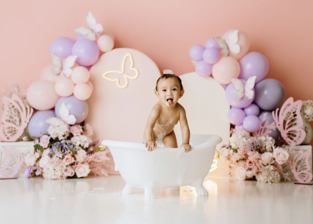 Adorable first birthday portrait of a baby girl at a Winnipeg photography studio.