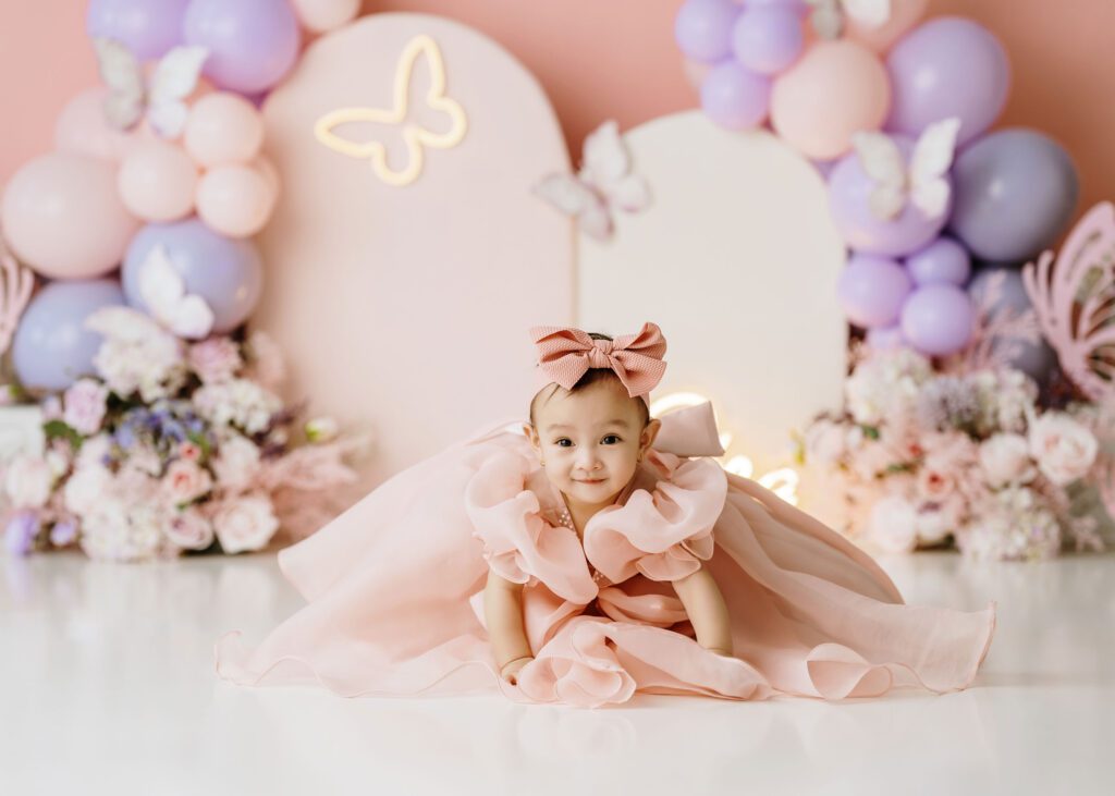 First birthday cake smash photography session for a baby girl in Winnipeg.
