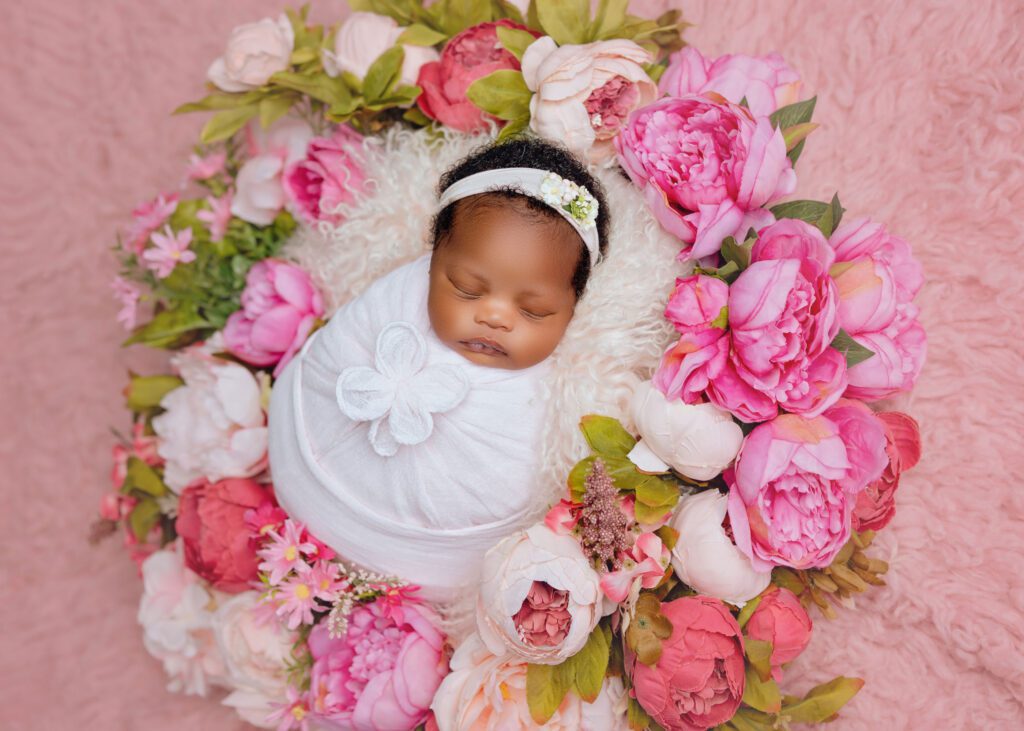 Timeless baby only newborn portrait with floral styling in Winnipeg studio