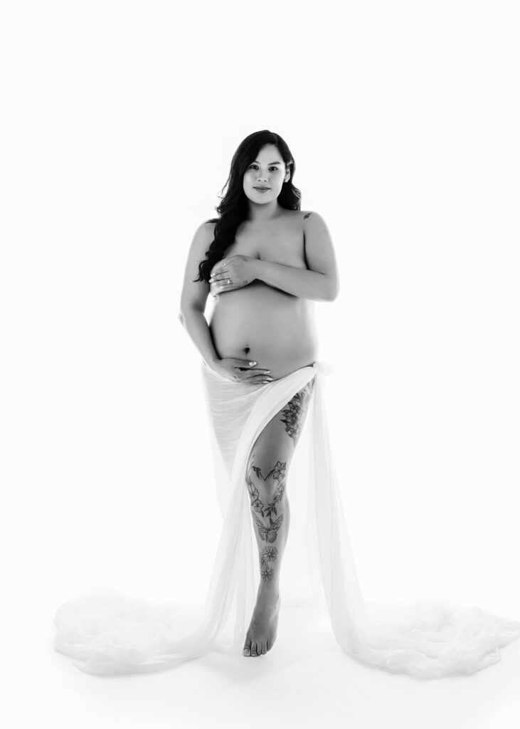 Classic maternity portrait with a minimalist studio backdrop