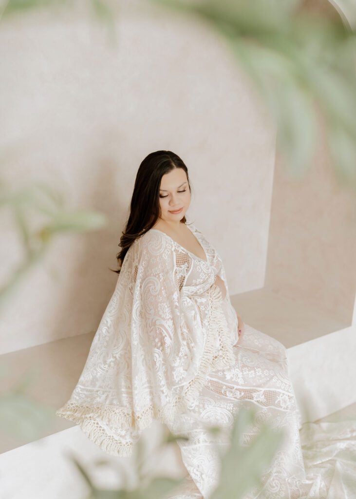 Winnipeg studio maternity photographer in a soft beige gown