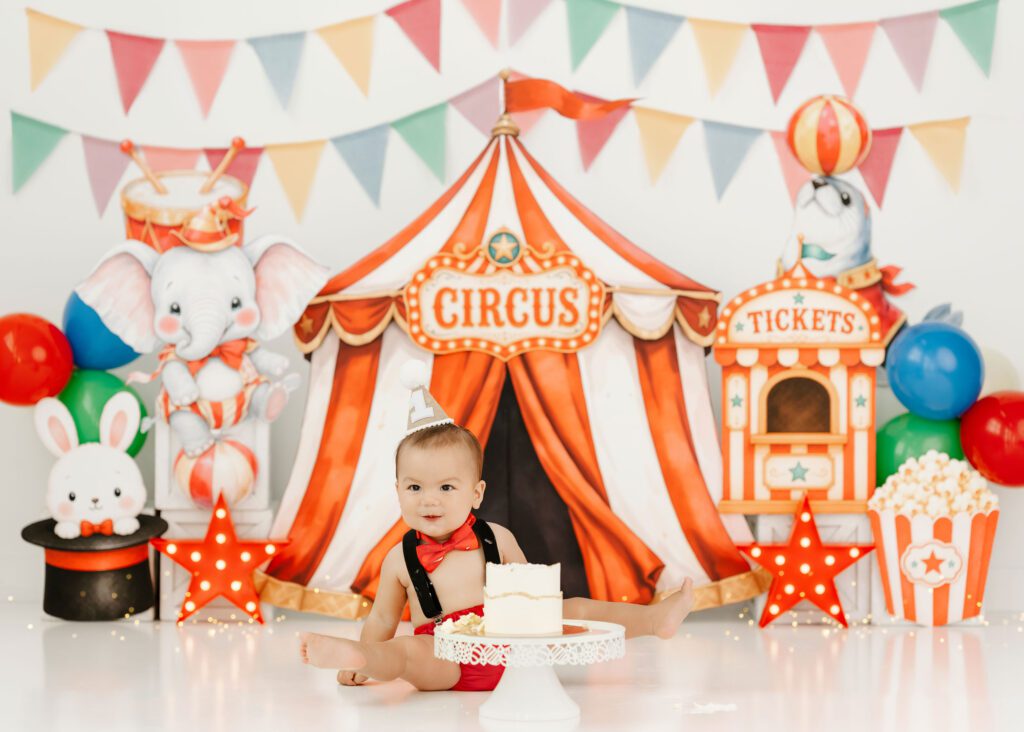 Baby celebrating first birthday with a circus cake smash in Winnipeg