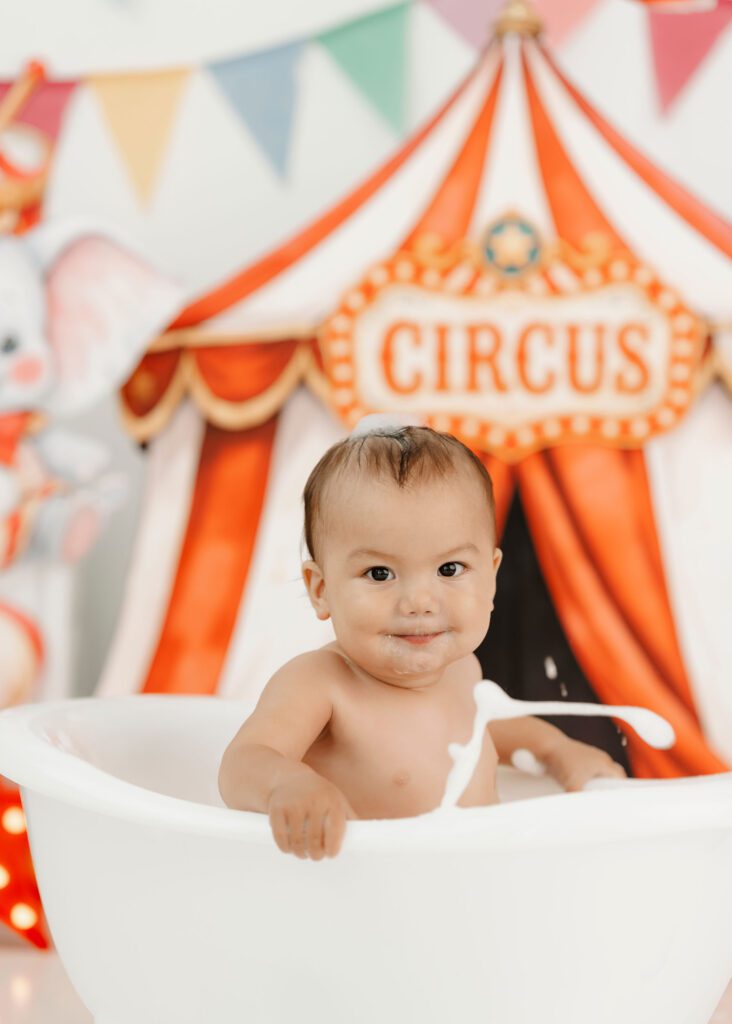 First birthday portrait in a circus cake smash setup in Winnipeg